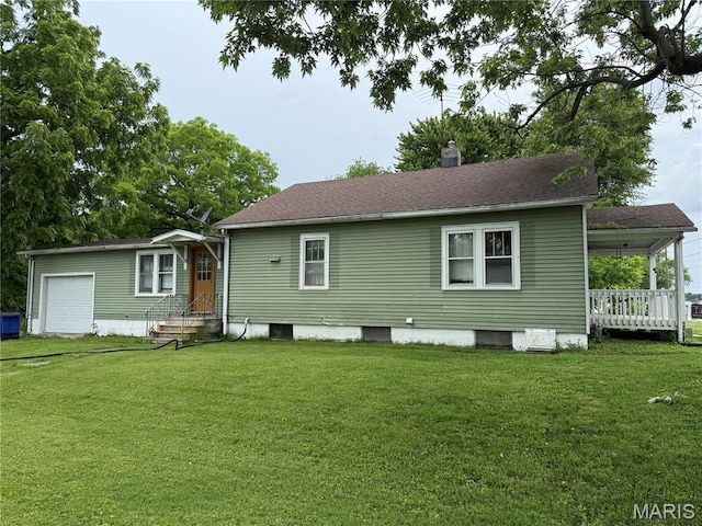 201 Kaskaskia, Ruma, IL 62278 - rear view of house with a yard, a garage, entry steps, and a chimney