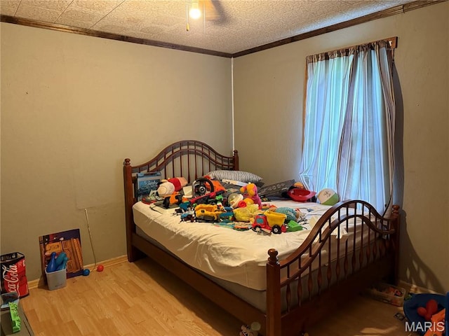 201 Kaskaskia, Ruma, IL 62278 - bedroom with wood finished floors, ornamental molding, and ceiling fan