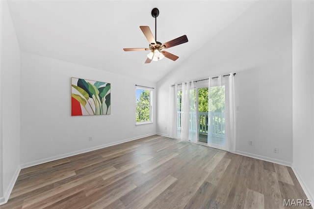 9740 Bexley Station Dr Unit 7J, Concord Township, MO 63123 - spare room featuring wood finished floors, ceiling fan, baseboards, and high vaulted ceiling