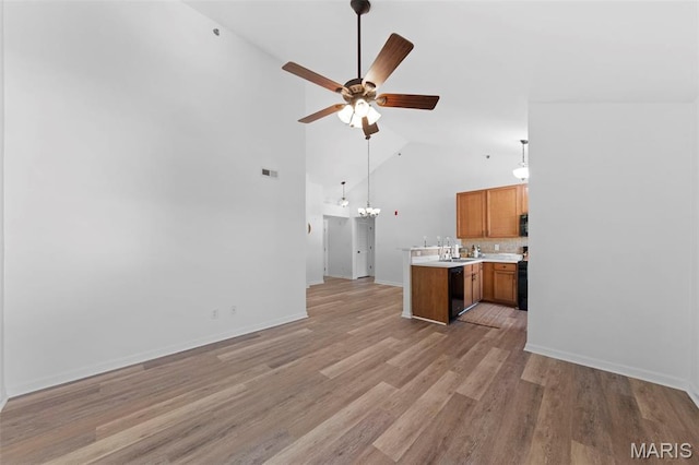 9740 Bexley Station Dr Unit 7J, Concord Township, MO 63123 - kitchen with high vaulted ceiling, ceiling fan, a sink, open floor plan, and light countertops