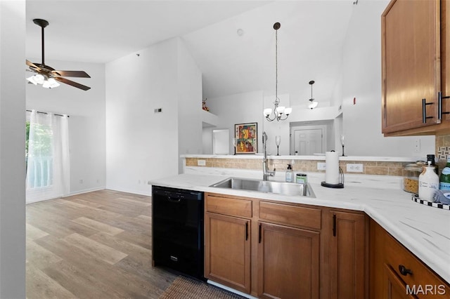 9740 Bexley Station Dr Unit 7J, Concord Township, MO 63123 - kitchen featuring dishwasher, a sink, brown cabinets, ceiling fan, and light wood-style flooring