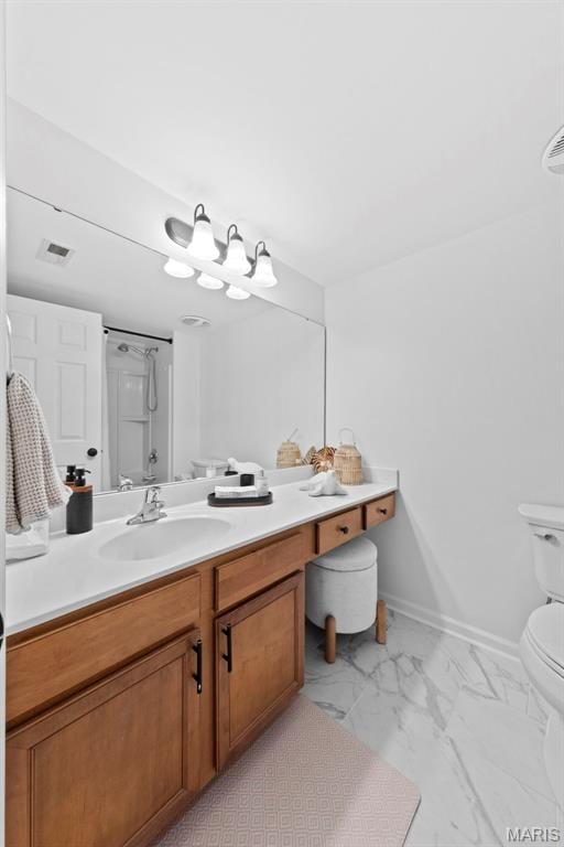 9740 Bexley Station Dr Unit 7J, Concord Township, MO 63123 - bathroom with toilet, marble finish floors, vanity, and baseboards