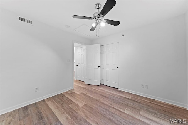 9740 Bexley Station Dr Unit 7J, Concord Township, MO 63123 - unfurnished bedroom featuring baseboards, wood finished floors, a ceiling fan, and a closet