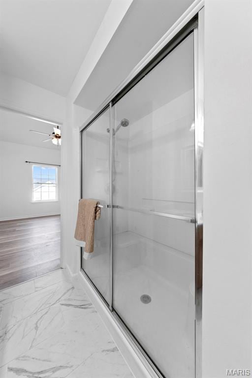 9740 Bexley Station Dr Unit 7J, Concord Township, MO 63123 - full bath with ceiling fan, a shower stall, and marble finish flooring