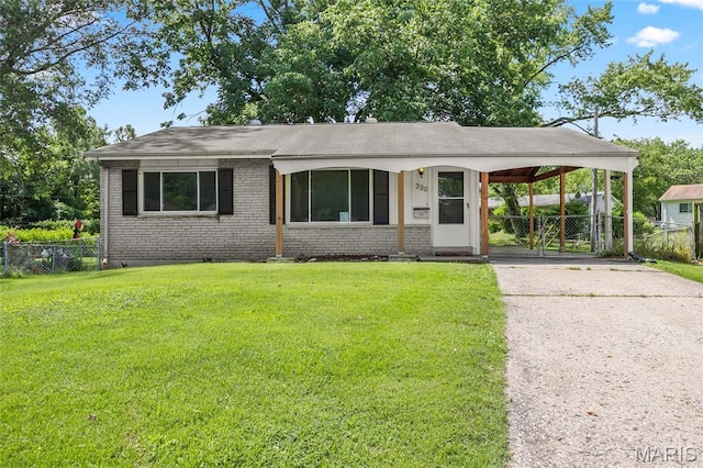 220 Versailles Dr, Florissant, MO 63031 - view of front of home featuring brick siding, driveway, an attached carport, and roof with shingles