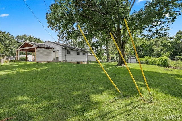 220 Versailles Dr, Florissant, MO 63031 - fenced backyard with a storage shed