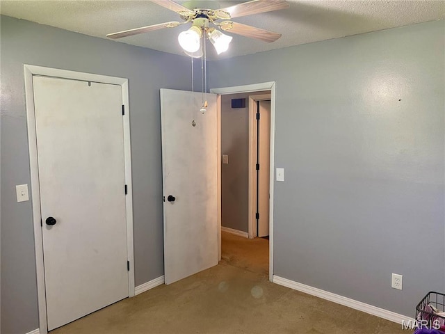 702 E Silver, Naylor, MO 63953 - unfurnished bedroom with carpet, baseboards, ceiling fan, and a closet