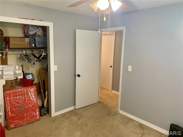 702 E Silver, Naylor, MO 63953 - bedroom featuring carpet, baseboards, a closet, and a ceiling fan