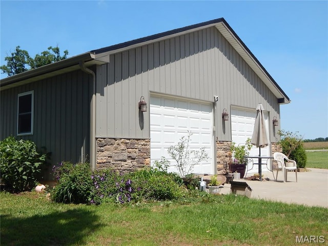 6230 Cuivre Ford Rd, Troy, MO 63379 - view of home's exterior featuring stone siding, a detached garage, and board and batten siding