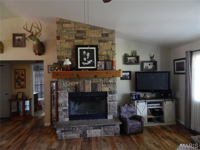 6230 Cuivre Ford Rd, Troy, MO 63379 - living room featuring vaulted ceiling, a stone fireplace, wood finished floors, and baseboards