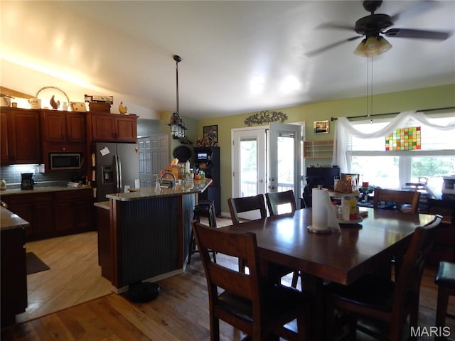 6230 Cuivre Ford Rd, Troy, MO 63379 - dining area featuring healthy amount of natural light, ceiling fan, light wood-style floors, vaulted ceiling, and french doors