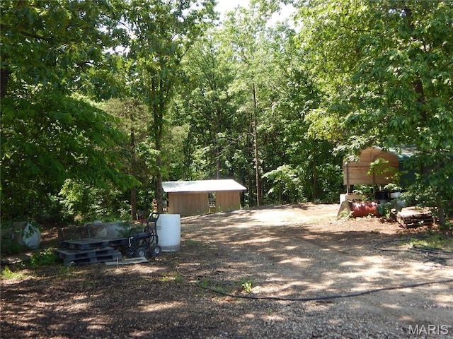 6230 Cuivre Ford Rd, Troy, MO 63379 - view of yard featuring an outbuilding and a wooded view