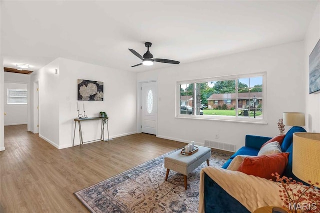 216 Clearpoint Ln, Saint Louis, MO 63123 - living room with wood finished floors, ceiling fan, and baseboards