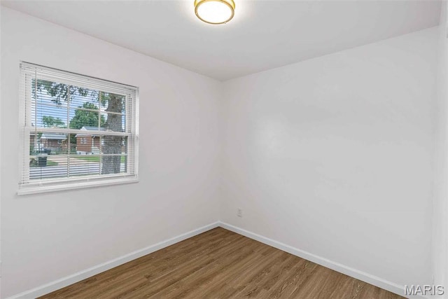 216 Clearpoint Ln, Saint Louis, MO 63123 - empty room featuring wood finished floors and baseboards