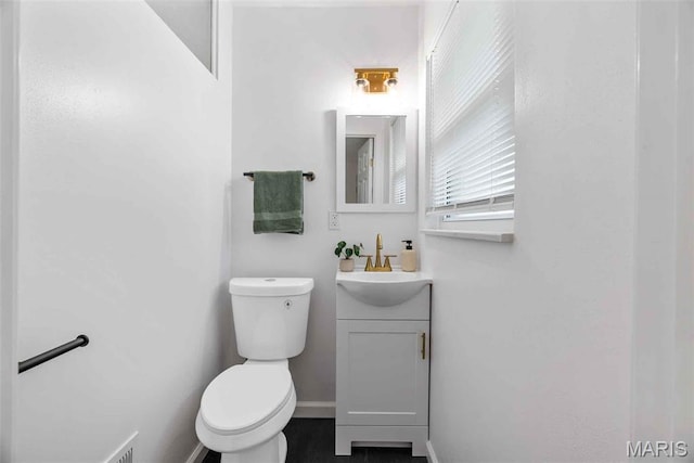 216 Clearpoint Ln, Saint Louis, MO 63123 - bathroom with toilet, vanity, and baseboards