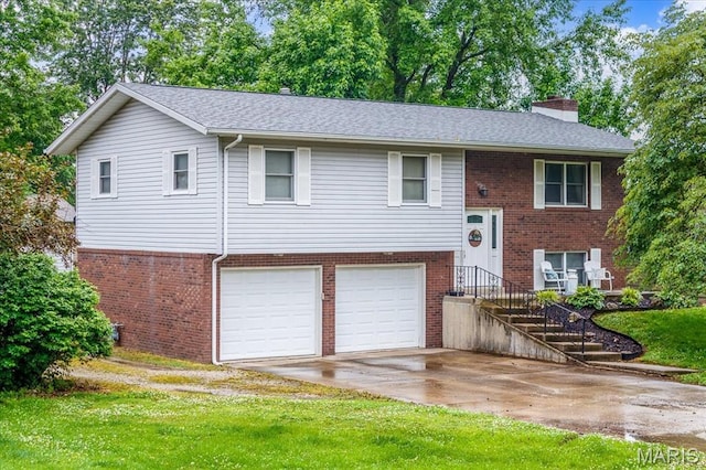 1170 Bond St, Carlyle, IL 62231 - bi-level home with a chimney, brick siding, a garage, and concrete driveway