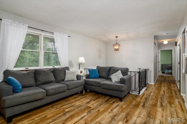 1170 Bond St, Carlyle, IL 62231 - living area with wood-type flooring and a chandelier