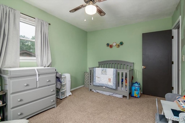 1170 Bond St, Carlyle, IL 62231 - bedroom featuring carpet floors, a nursery area, and ceiling fan