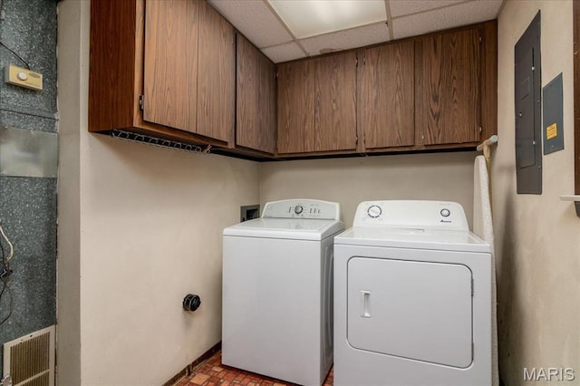 1170 Bond St, Carlyle, IL 62231 - washroom featuring cabinet space, electric panel, brick patterned floors, and separate washer and dryer