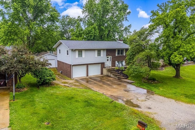 1170 Bond St, Carlyle, IL 62231 - bi-level home with brick siding, an attached garage, a chimney, driveway, and a front lawn