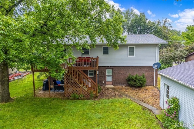 1170 Bond St, Carlyle, IL 62231 - back of house featuring stairway, a deck, a yard, and brick siding