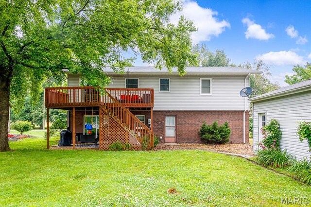 1170 Bond St, Carlyle, IL 62231 - rear view of house with a wooden deck, stairway, a lawn, and brick siding