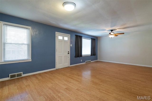 8217 Buchanan Ave, Saint Louis, MO 63114 - foyer entrance featuring light wood finished floors and ceiling fan