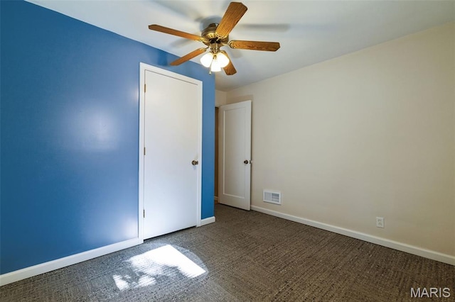 8217 Buchanan Ave, Saint Louis, MO 63114 - empty room with ceiling fan and carpet flooring