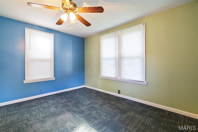 8217 Buchanan Ave, Saint Louis, MO 63114 - empty room featuring dark carpet and ceiling fan
