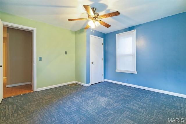 8217 Buchanan Ave, Saint Louis, MO 63114 - unfurnished bedroom featuring carpet flooring, a ceiling fan, and a closet