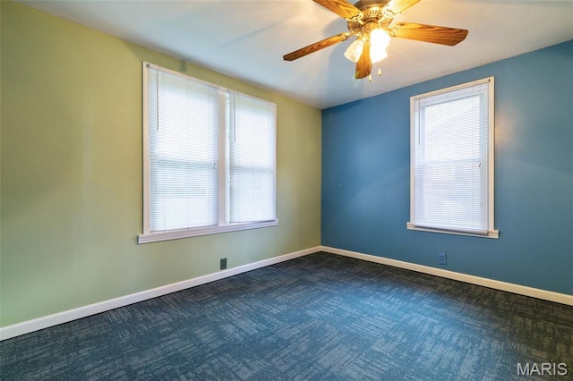 8217 Buchanan Ave, Saint Louis, MO 63114 - unfurnished room with healthy amount of natural light, dark carpet, and a ceiling fan