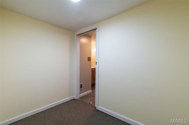 8217 Buchanan Ave, Saint Louis, MO 63114 - spare room featuring baseboards and carpet