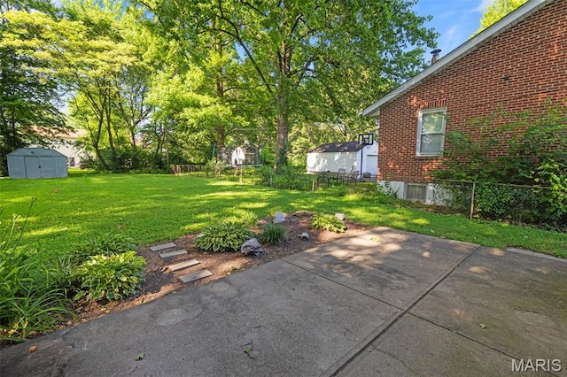 8217 Buchanan Ave, Saint Louis, MO 63114 - view of yard featuring a storage shed and a patio