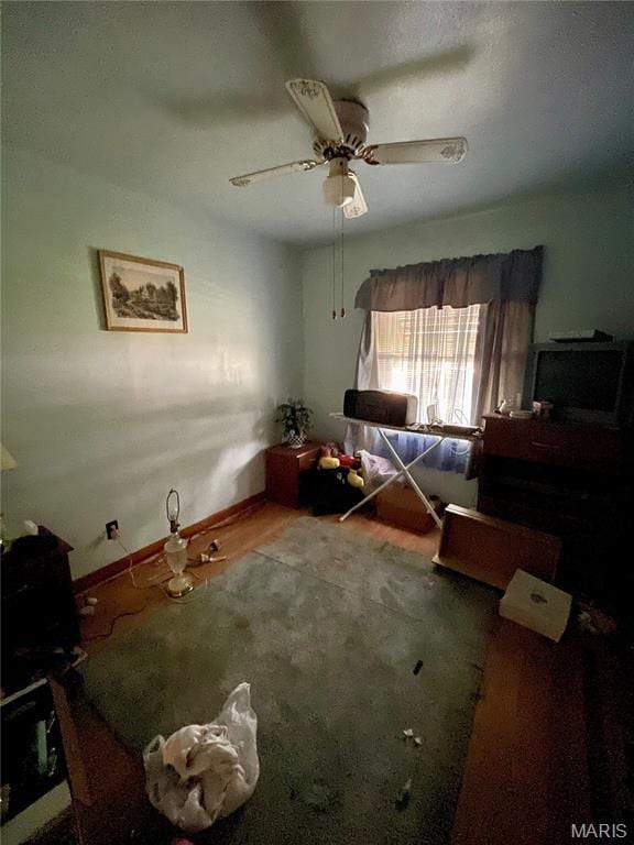329 Kirk Dr, Ferguson, MO 63135 - bedroom featuring baseboards, ceiling fan, and wood finished floors