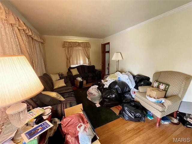 329 Kirk Dr, Ferguson, MO 63135 - living room featuring wood finished floors and crown molding