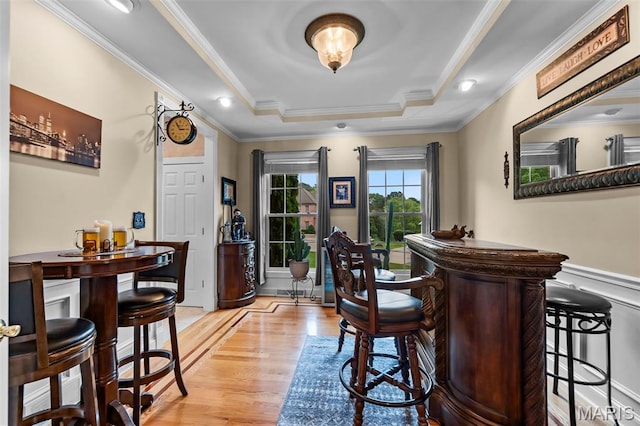 807 Caribou Ct, Cape Girardeau, MO 63701 - indoor dry bar with light wood finished floors, ornamental molding, and a raised ceiling