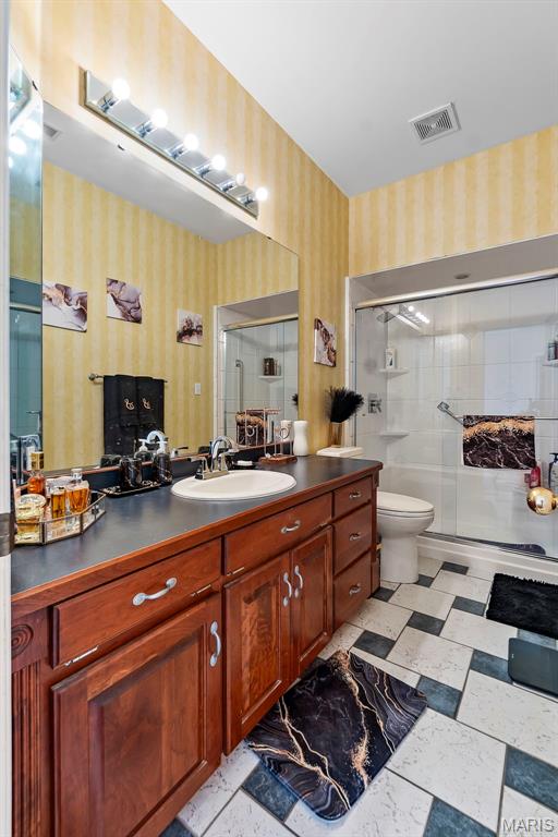 807 Caribou Ct, Cape Girardeau, MO 63701 - full bathroom with wallpapered walls, vanity, a shower stall, and toilet
