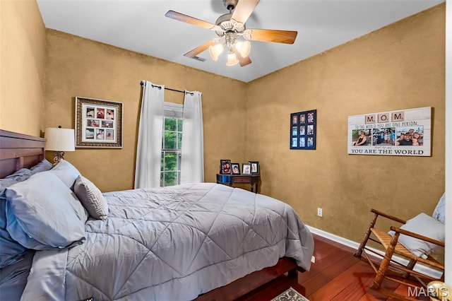 807 Caribou Ct, Cape Girardeau, MO 63701 - bedroom with wood finished floors, baseboards, a ceiling fan, and a textured wall