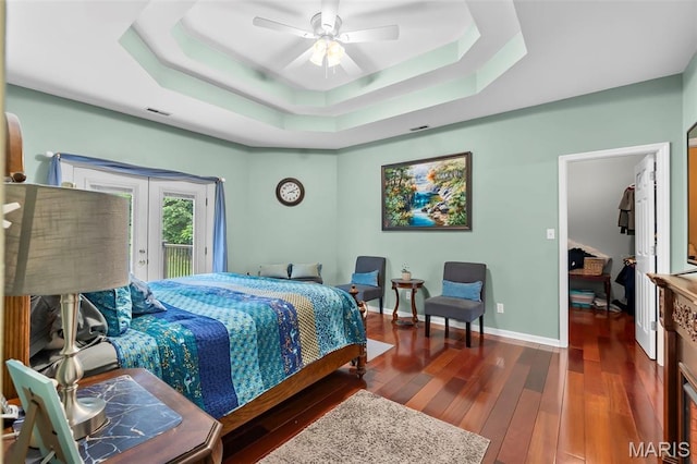 807 Caribou Ct, Cape Girardeau, MO 63701 - bedroom featuring a tray ceiling, access to exterior, dark wood finished floors, french doors, and baseboards