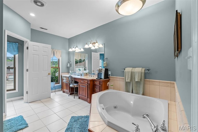 807 Caribou Ct, Cape Girardeau, MO 63701 - bathroom featuring vanity, a tub with jets, and tile patterned flooring