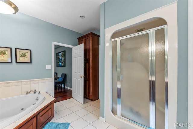 807 Caribou Ct, Cape Girardeau, MO 63701 - full bathroom featuring a stall shower, a jetted tub, and tile patterned floors