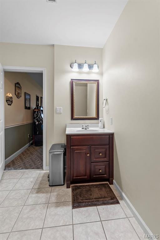 807 Caribou Ct, Cape Girardeau, MO 63701 - bathroom featuring tile patterned flooring, vanity, and baseboards