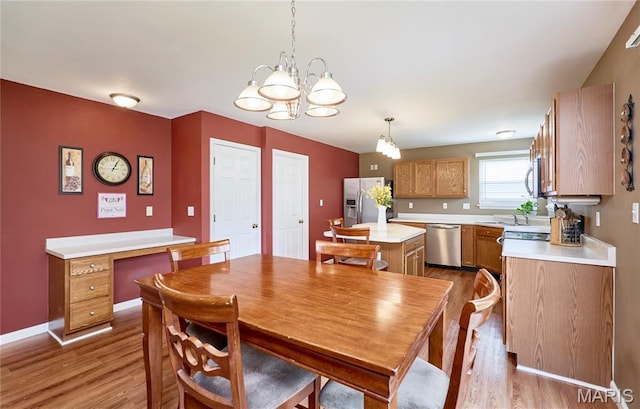 2052 Peine Frst, Wentzville, MO 63385 - dining space with wood finished floors and a chandelier