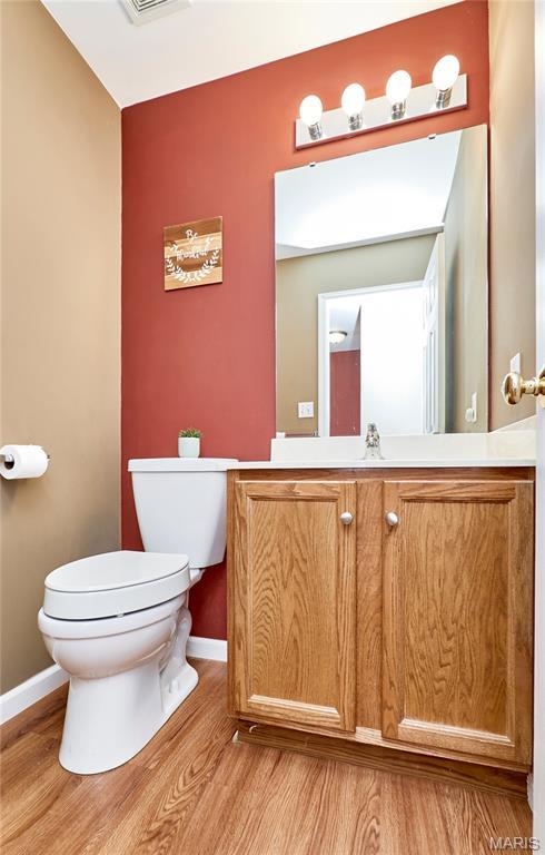 2052 Peine Frst, Wentzville, MO 63385 - bathroom featuring wood finished floors and vanity