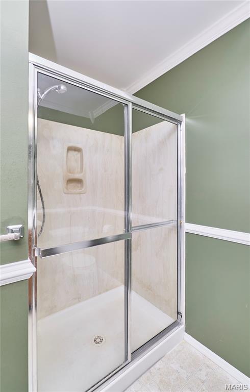 2052 Peine Frst, Wentzville, MO 63385 - full bathroom with a stall shower and ornamental molding