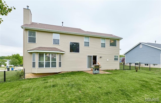 2052 Peine Frst, Wentzville, MO 63385 - rear view of house featuring a fenced backyard and a chimney