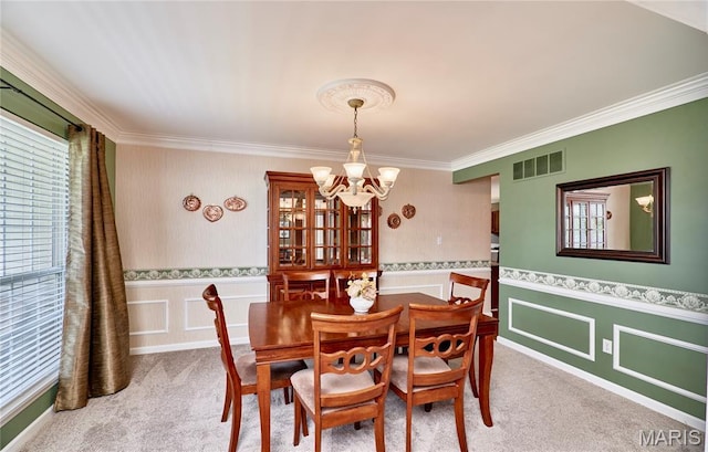 2052 Peine Frst, Wentzville, MO 63385 - carpeted dining room with a chandelier, ornamental molding, wainscoting, and a decorative wall