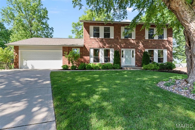 113 Christine Cay Ct, Saint Charles, MO 63304 - colonial-style house featuring concrete driveway, a front yard, an attached garage, and brick siding