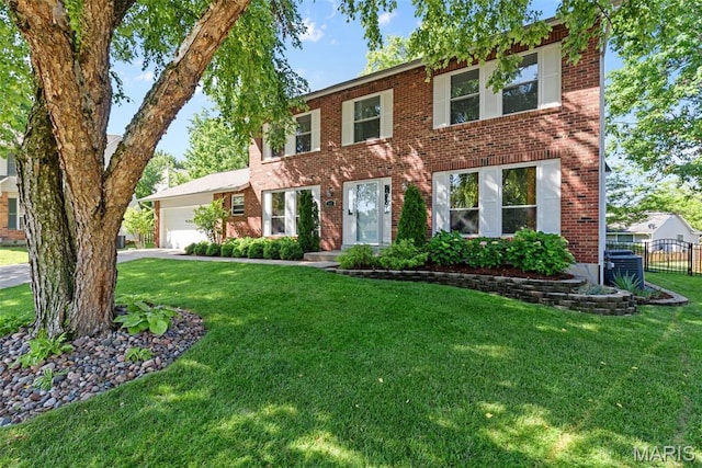 113 Christine Cay Ct, Saint Charles, MO 63304 - colonial-style house with brick siding, a garage, and driveway