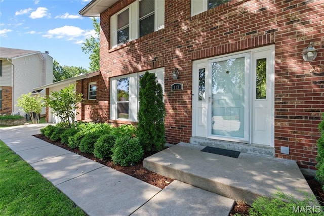 113 Christine Cay Ct, Saint Charles, MO 63304 - view of exterior entry featuring brick siding and an attached garage